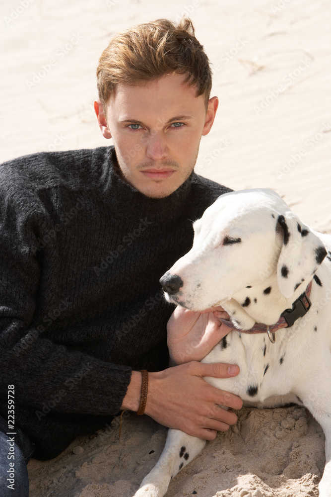 Portrait Of Teenage Boy On Beach With Dog Portrait Of Teenage Boy On Beach With Dog