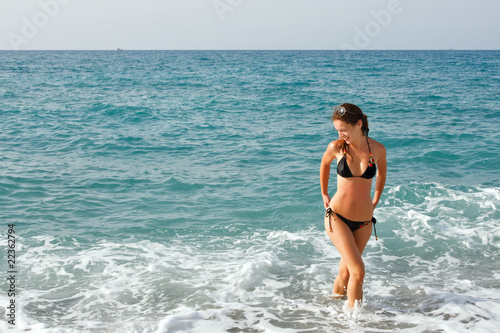 Beautiful young woman on the beach © sborisov
