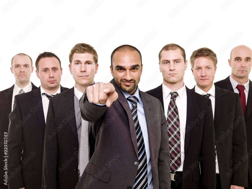 Pointing man in front of his team Pointing man in front of his team