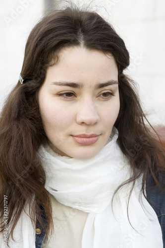Canvas Print close up portrait of serious woman with white scarf