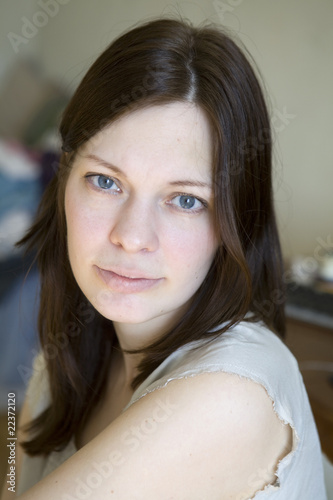 Canvas Print close up portrait of serious woman with blue eyes