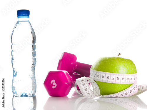 Dumbbells, apple, measure tape and bootle of water