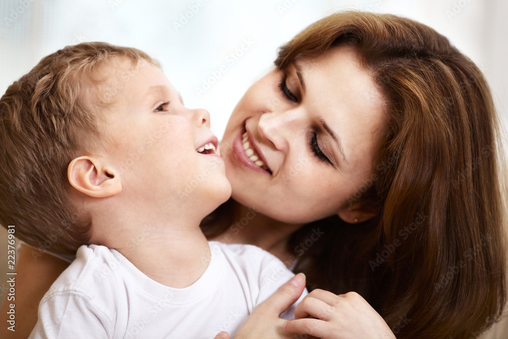 mother hugging her little son mother hugging her little son