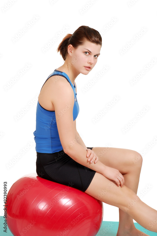 woman resting on red exercise ball woman resting on red exercise ball