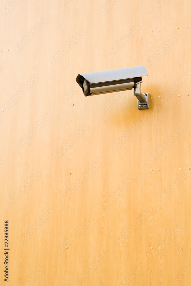 Security camera over brown background Security camera over brown background