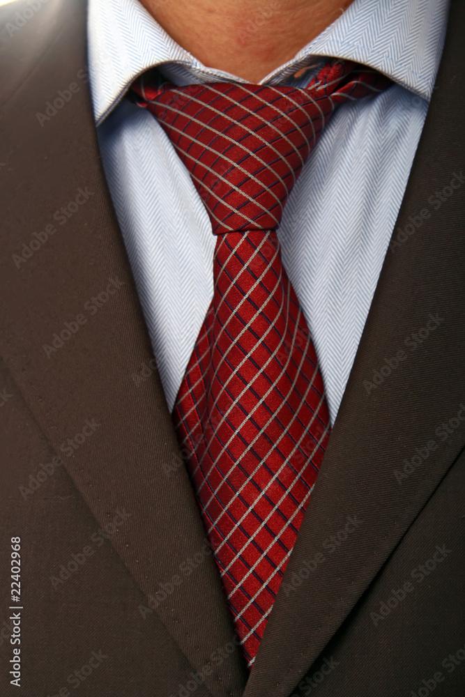 detail of a Business man Suit with red tie detail of a Business man Suit with red tie