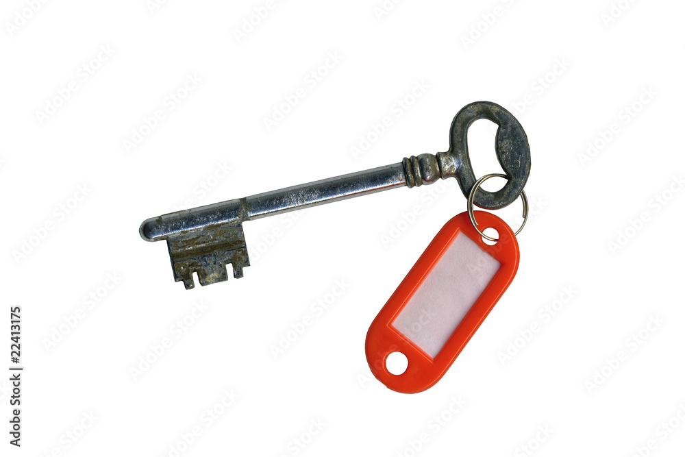 Old key isolated against white background