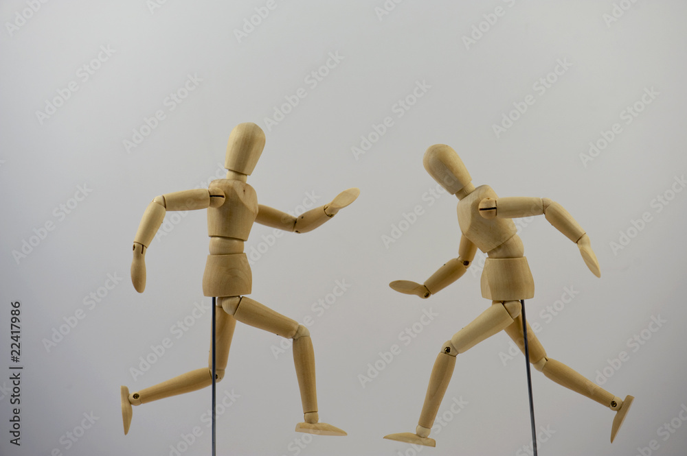Two mannequins positioned into a hurrying posture Two mannequins positioned into a hurrying posture