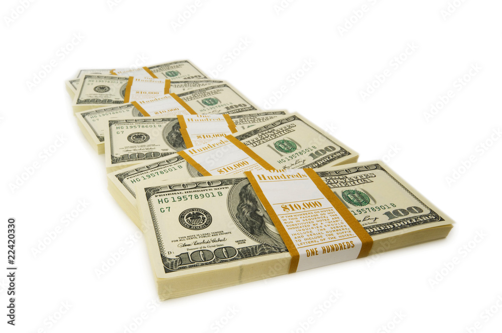 Stack of dollars isolated on the white Stack of dollars isolated on the white