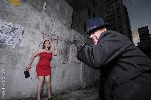 Man mugging the woman in an alley