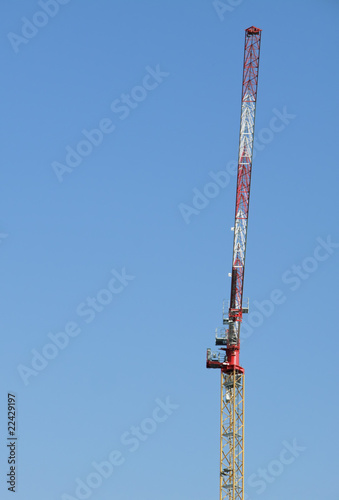 Building crane on blue sky