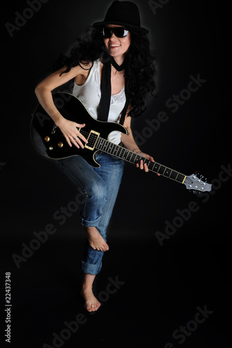 Beautiful smiling girl with a guitar