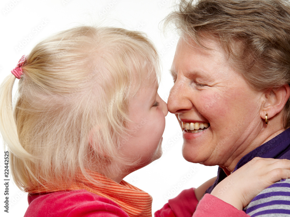 Granddaughter and grandmother touching their nose Granddaughter and grandmother touching their nose