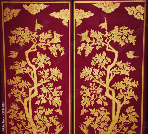 Golden artistic door decoration in Thailand