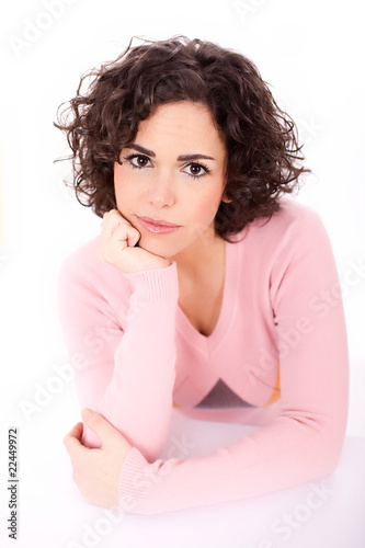 Pensive young woman in dilemma for a decision
