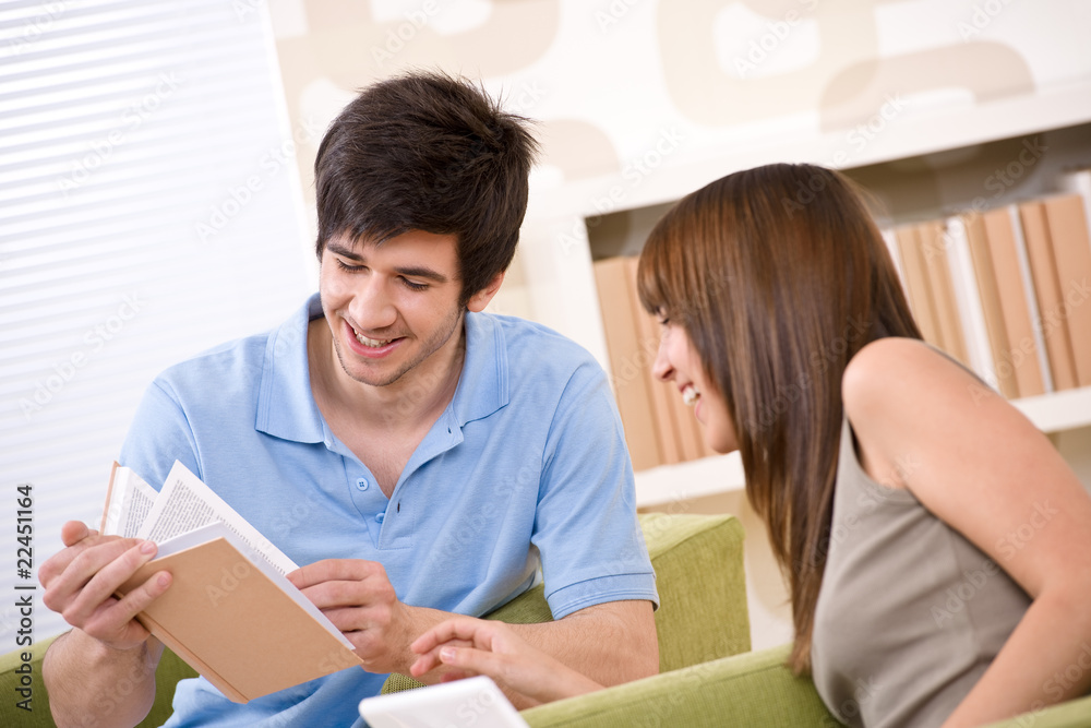 Student - two teenager reading book home Student - two teenager reading book home