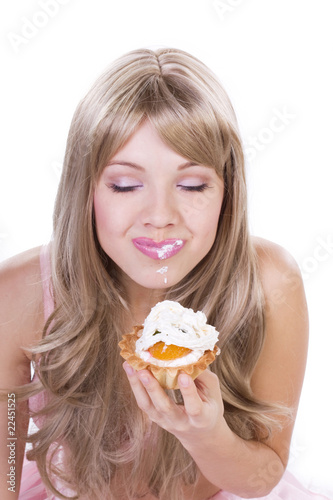 Attractive woman with a cake. Close-up portrait.