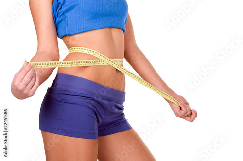 Measure tape around slim beautiful waist photo