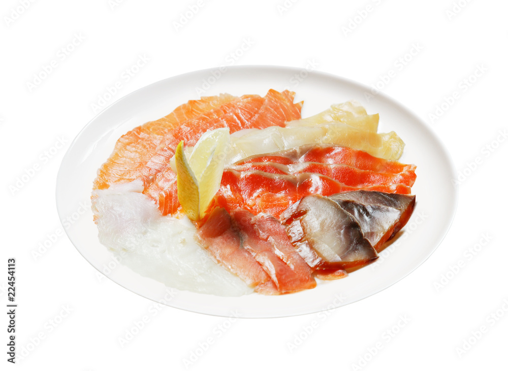 Cutting from red fish with lemon segment on dish isolated on whi Cutting from red fish with lemon segment on dish isolated on whi