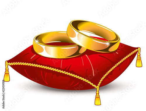 wedding rings on red satin pillow with gold tassels