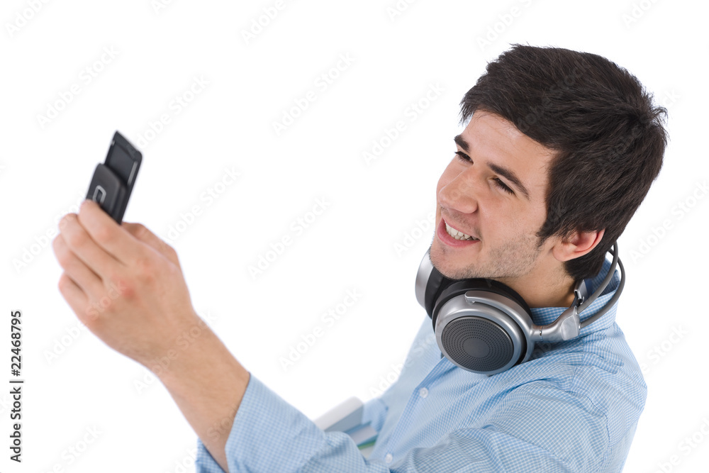 Male student taking photo with mobile phone
