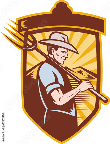Farmer with pitch fork and mountains in back