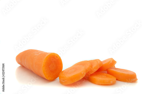 Partially sliced carrot.