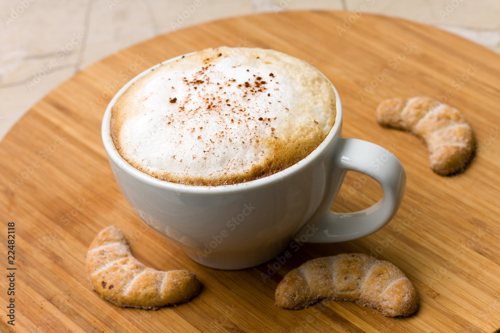 fresh cappuccino in the Cup with Cookies fresh cappuccino in the Cup with Cookies