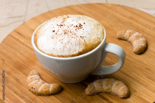 fresh cappuccino in the Cup with Cookies