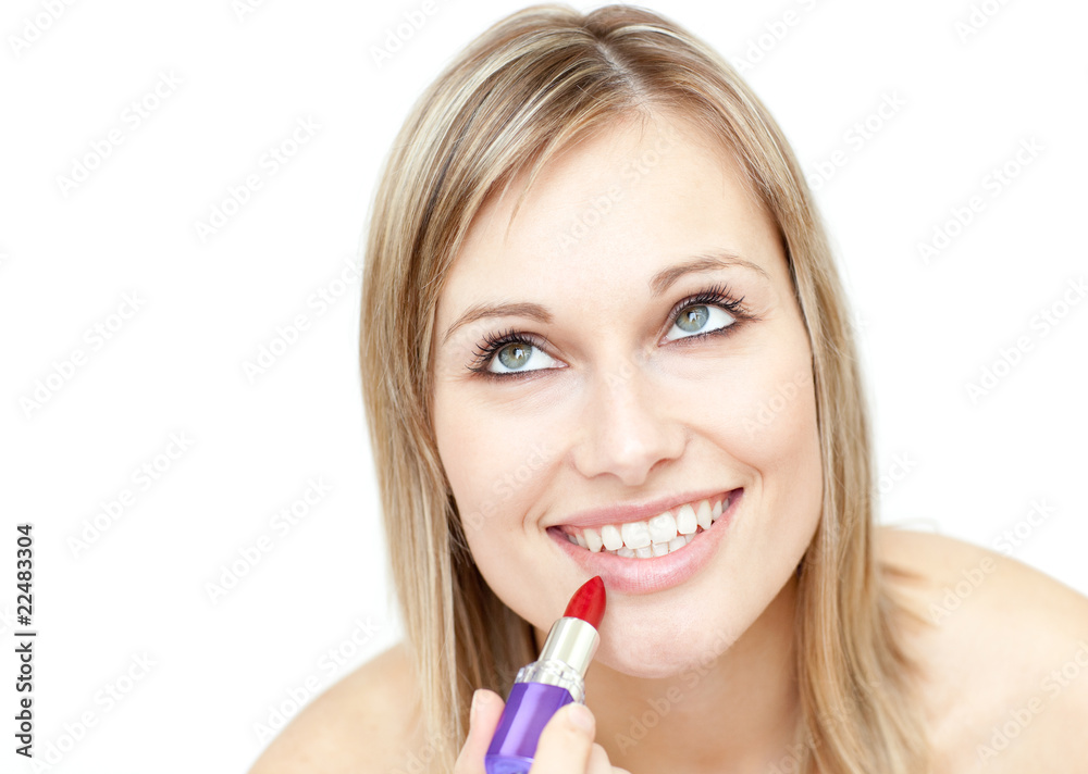 Attractive blond woman putting lipstick Attractive blond woman putting lipstick