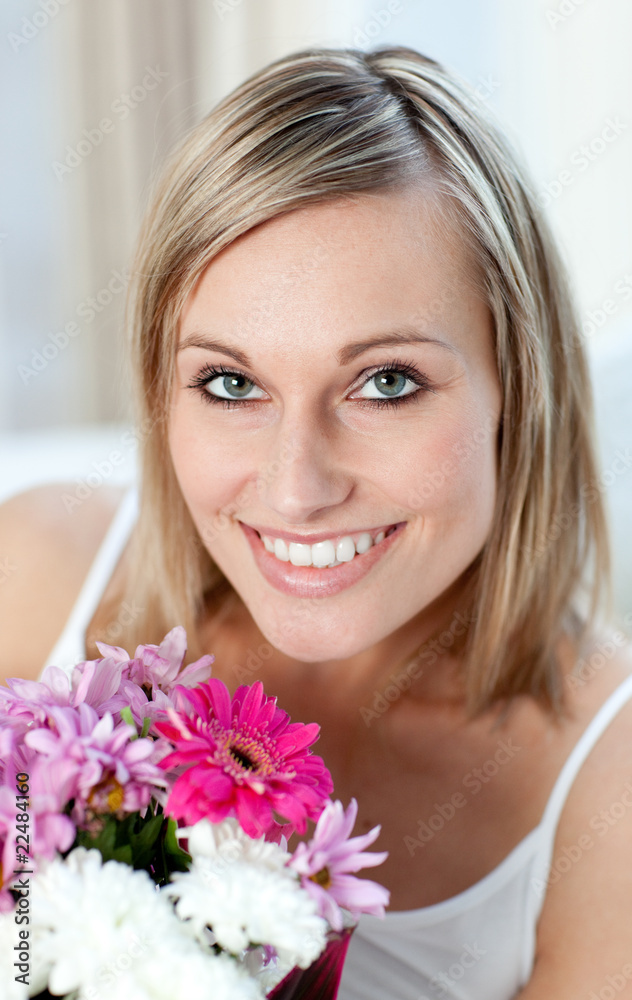 Portrait of a happy woman holding a bunch of flowers Portrait of a happy woman holding a bunch of flowers