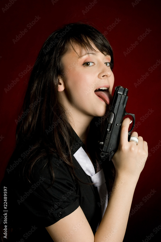 Prettty woman licking a gun Prettty woman licking a gun