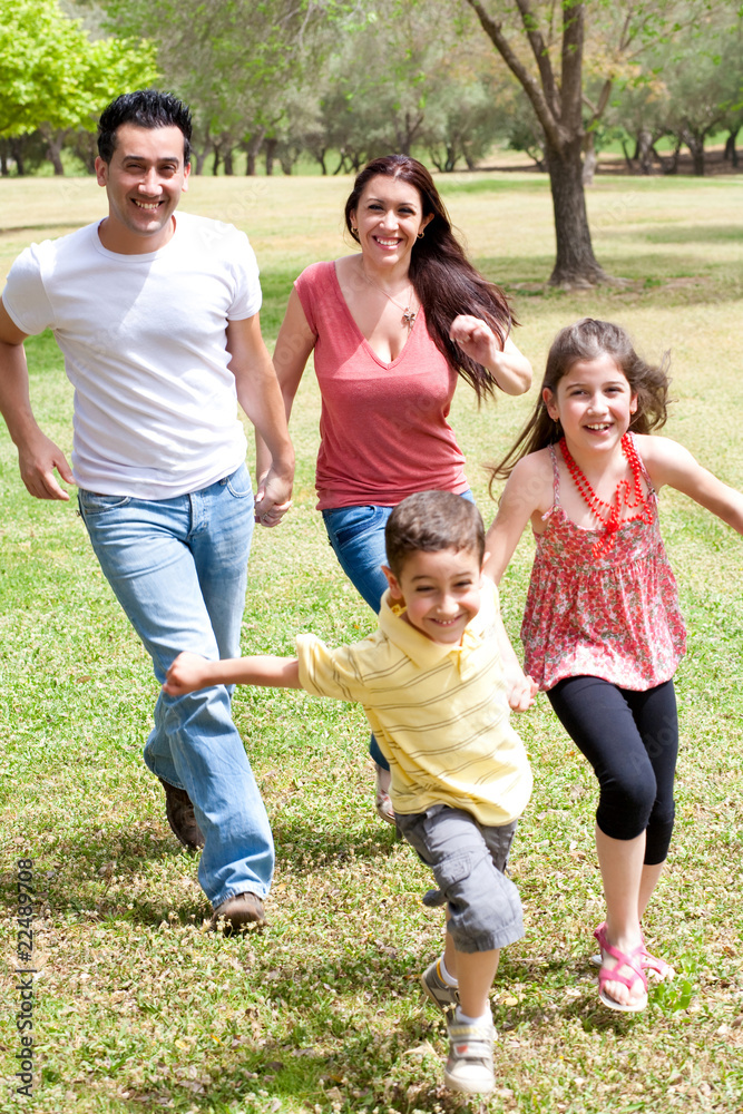 Family playing in the green field Family playing in the green field