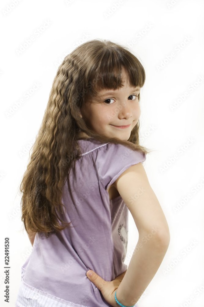 Beautiful little girl with long hair, posing.