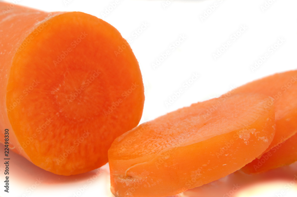 Partially sliced carrot. Partially sliced carrot.