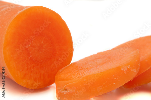 Partially sliced carrot.