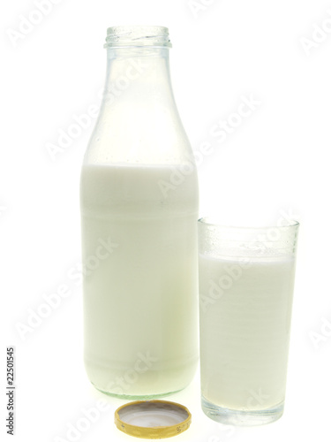 bottle and glass of fresh milk on white background