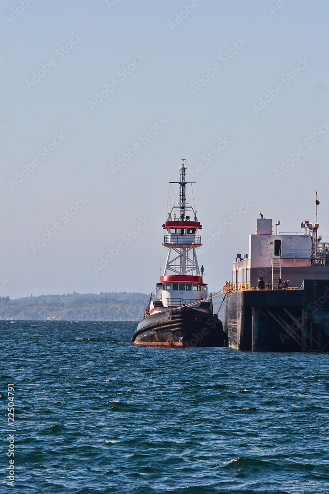 Red White and Black Tugboat by Barge