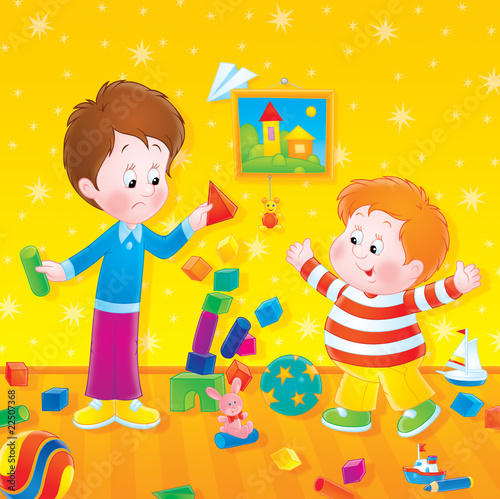 Two boys play with bricks i...