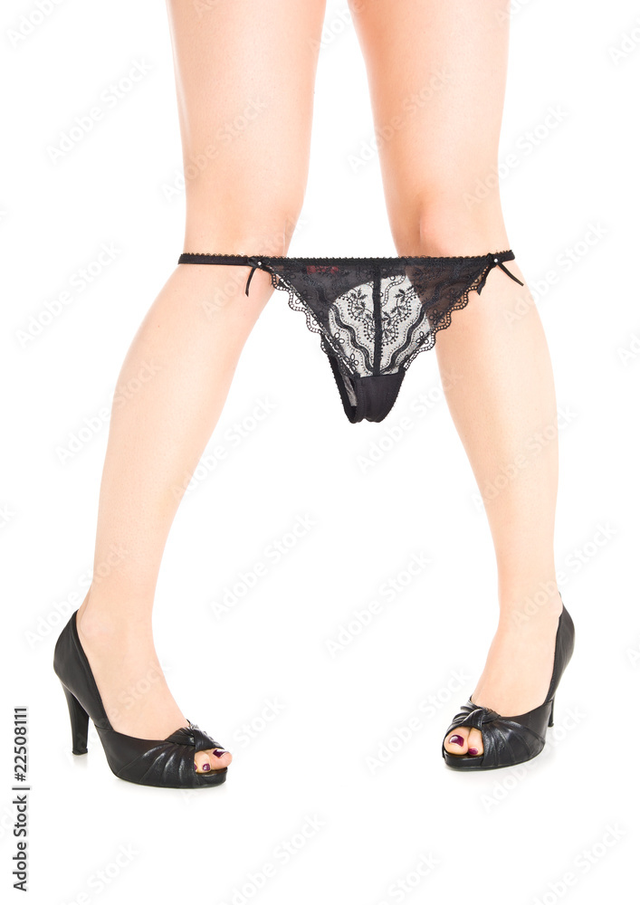 Woman legs in high heels with lace underwear on isolated white b Woman legs in high heels with lace underwear on isolated white b