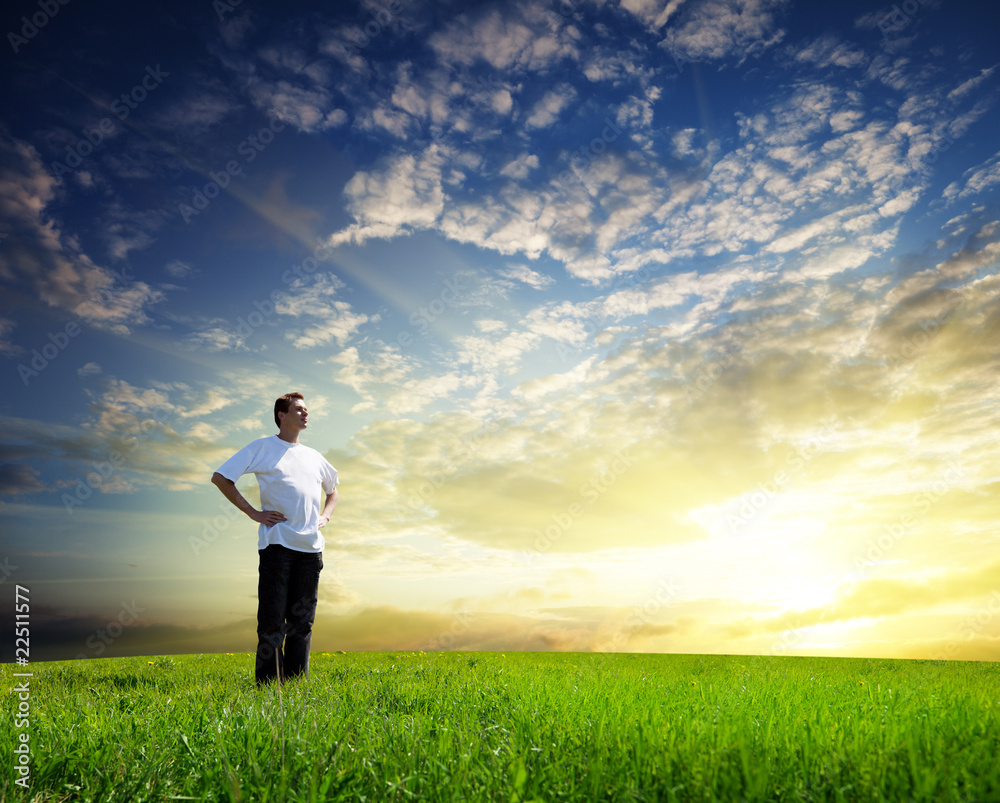 Young man on spring field