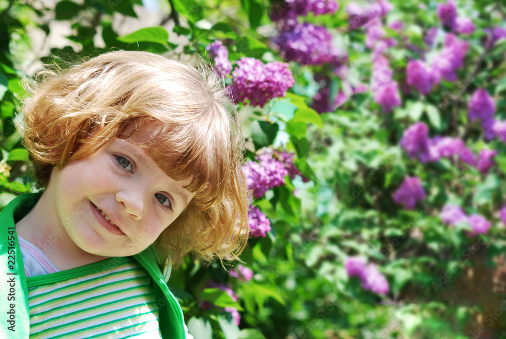 little girl in lilac garden