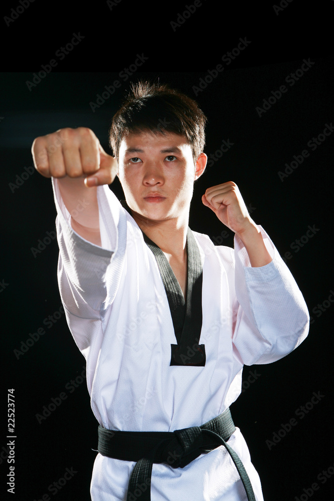 one asian man is playing with taekwondo one asian man is playing with taekwondo