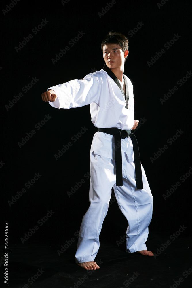 one asian man is playing with taekwondo one asian man is playing with taekwondo