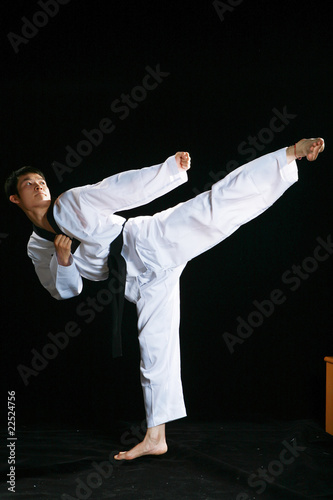 one asian man is playing with taekwondo