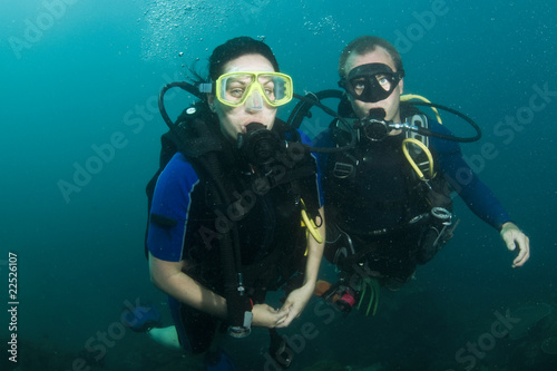 two scuba divers on a dive