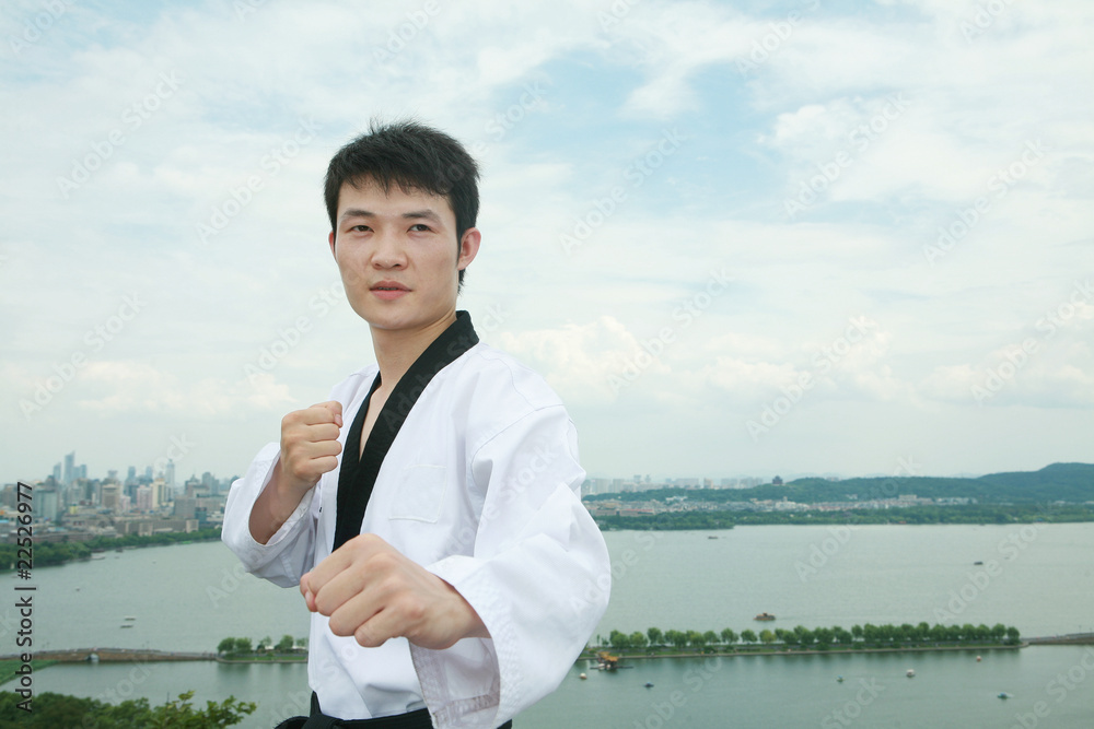 one asian man playing with taekwondo outdoor one asian man playing with taekwondo outdoor