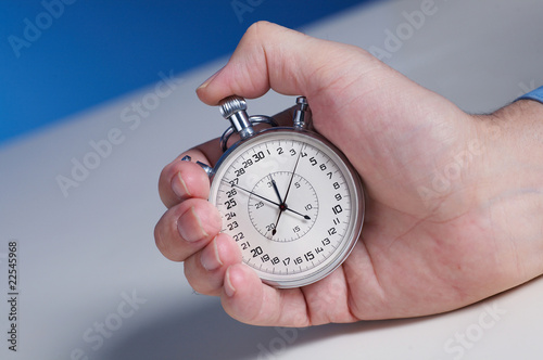 businessman's hand with stopwatch