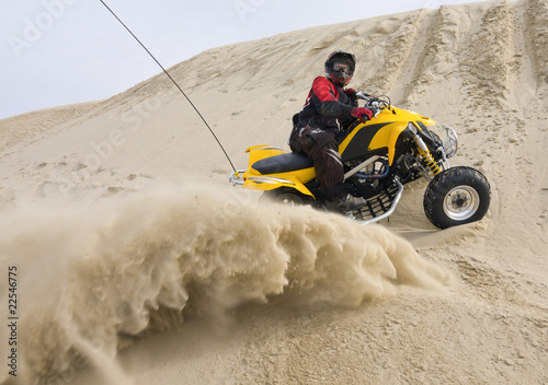 ATV rider spraying sand photo