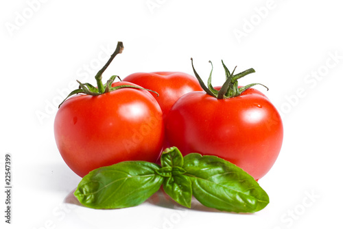 fresh red tomatoes isolated on white background